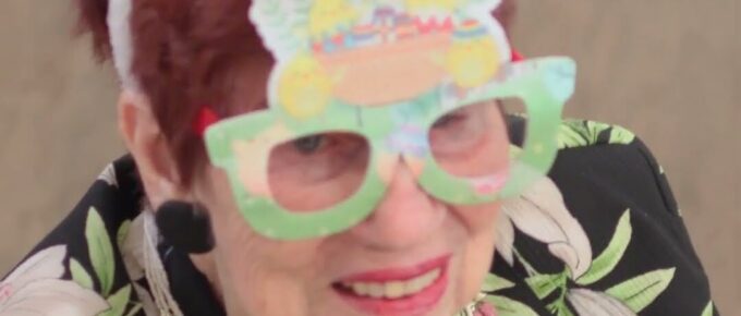 Resident wearing bunny ears at the Easter celebration at Brookstone Terrace of Greensboro
