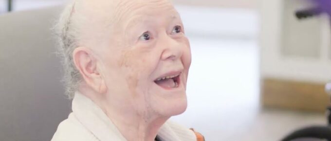 Resident smiling during morning fitness at Brookstone Terrace of Greensboro