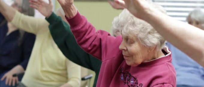 Residents stretching during a yoga class at Brookstone Terrace of Thomasville
