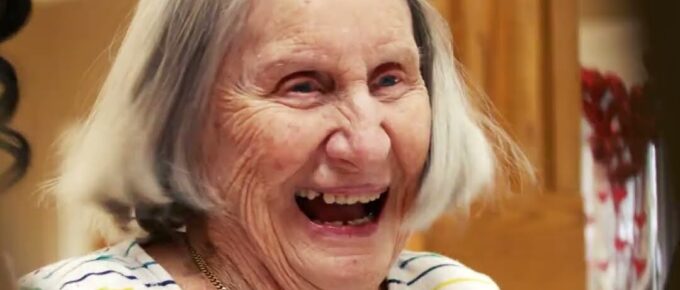 Resident smiling at the Valentine’s Day celebration at Brookstone Terrace of Clemmons