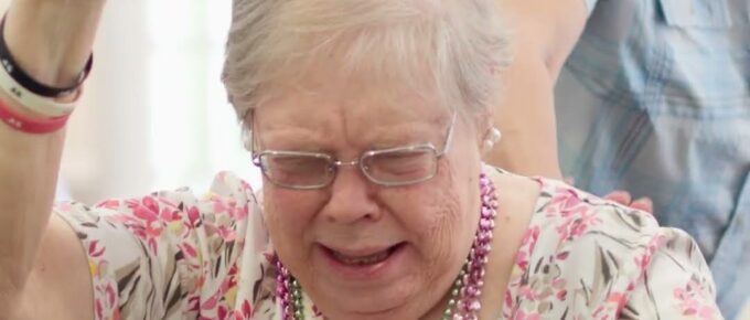 Resident laughing during weekly bingo at Brookstone Terrace of Greensboro