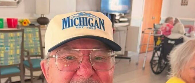 Darrell smiling in his Michigan shirt at Brookstone Terrace
