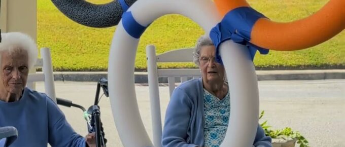 Residents playing Olympic Ring Ball Toss outside Brookstone Terrace of Thomasville, NC