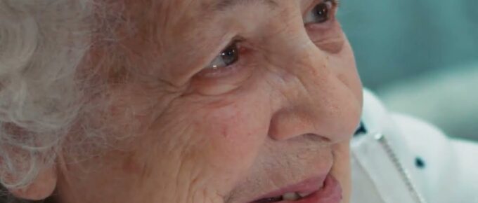 Smiling resident enjoying manicure day at Brookstone Terrace assisted living in Clemmons, NC